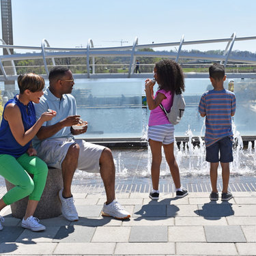 Family enjoying ice cream at Yards Park on the Capitol Riverfront - Family-friendly vacations in Washington, DC Family enjoying ice cream at Yards Park on the Capitol Riverfront - Family-friendly vacations in Washington, DC